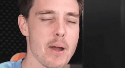 Man Making Funny Face Eyes Closed