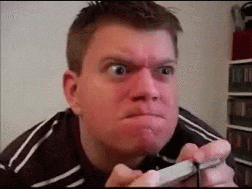Man Making Funny Face Holding Cell Phone GIF