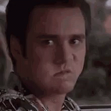 Man Making Funny Face In Car GIF