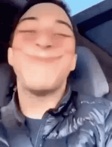 Man Making Funny Face in Car