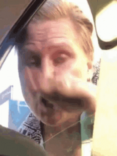 Man Making Funny Face in Car