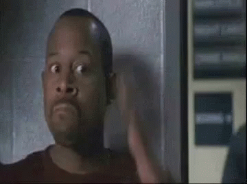 Man Making Funny Face in Dark Room