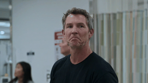 Man Making Funny Face In Front Of Emergency Room Sign GIF