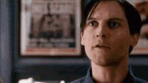 Man Making Funny Face In Front Of Framed Picture GIF