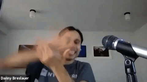 Man Making Funny Face in Front of Microphone