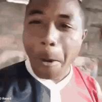 Man Making Funny Face in Red and Blue Shirt and Tie