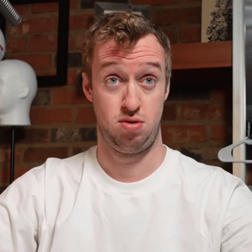 Man Making Funny Face in White Shirt