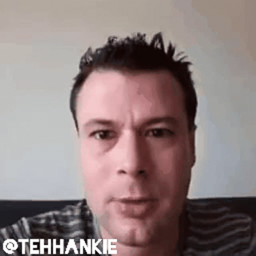 Man Making Funny Face on Couch