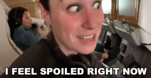 Man Making Funny Face on Plane With Woman
