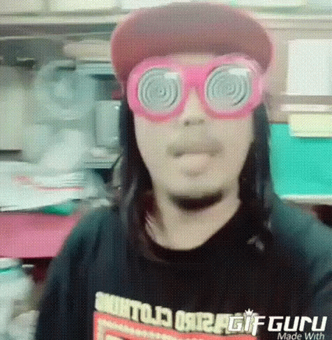 Man Making Funny Face Red Hat Pink Glasses