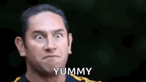 Man Making Funny Face Saying Yummy