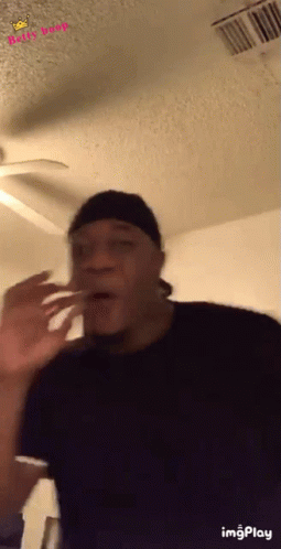 Man Making Funny Face with Ceiling Fan