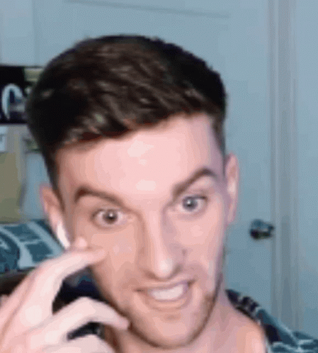 Man Making Funny Face with Finger on Nose
