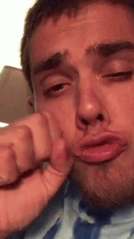 Man Making Funny Face With Hand On Face GIF