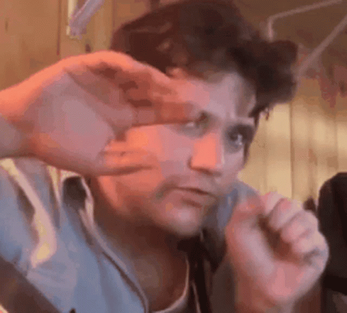 Man Making Funny Face with Hands