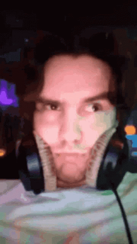 Man Making Funny Face With Headphones