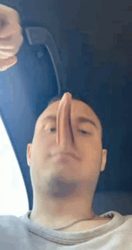 Man Making Funny Face with Nose in Air