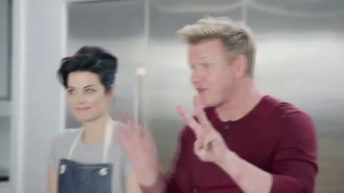 Man Making Peace Sign with Woman