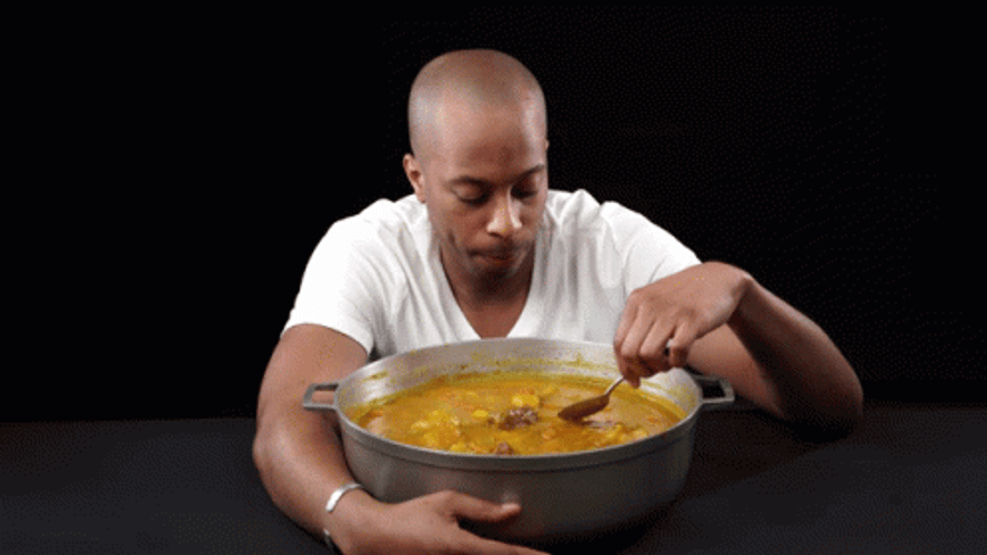 Man Munching On Pot Of Curry GIF