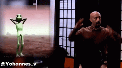 Man Next To Green Alien Dancing GIF