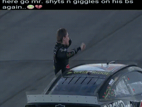 Man Next to Race Car Saying Dente