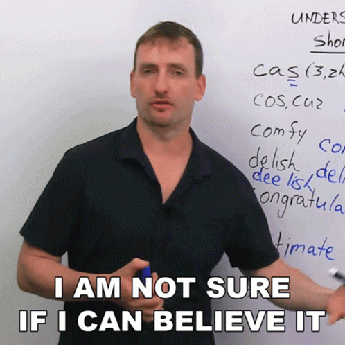 Man Not Sure If He Can Believe It at Whiteboard