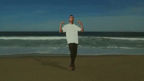 Man On Beach Arms Outstretched GIF