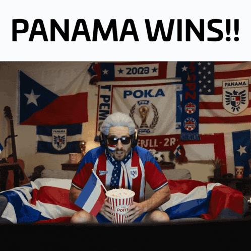 Man On Bed Holding Popcorn And Panama Wins Sign GIF