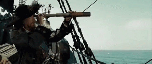 Man on Boat Looking Through Telescope at Ocean