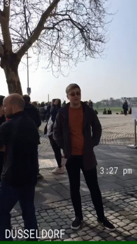 Man On Brick Sidewalk In Dusseldorf 3:27 PM GIF