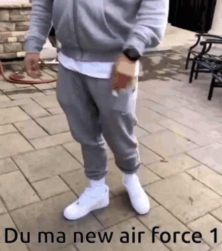 Man on Brick Sidewalk Saying Du Ma New Air Force 1