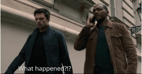 Man on Cell Phone While Another Says What Happened