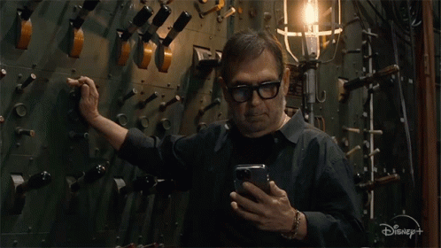 Man On Cell Phone With Disney+ GIF