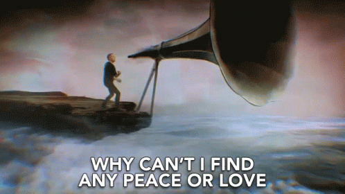 Man On Cliff Playing Trumpet Saying Why Can't I Find Any Peace Or Love GIF