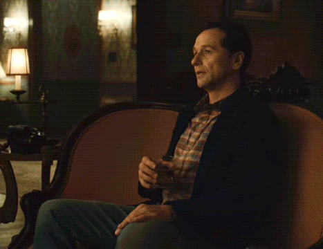 Man On Couch Holding Glass Saying Yeees GIF