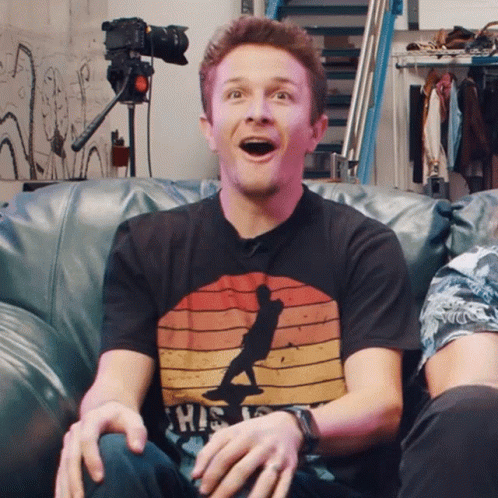 Man On Couch Wearing Shirt Saying This Is GIF