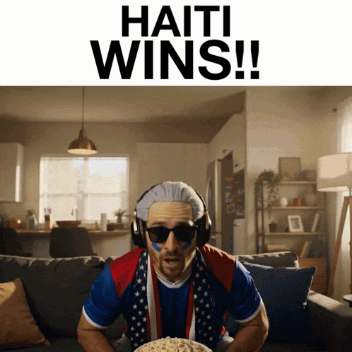 Man on Couch With Bowl of Popcorn Haiti Wins