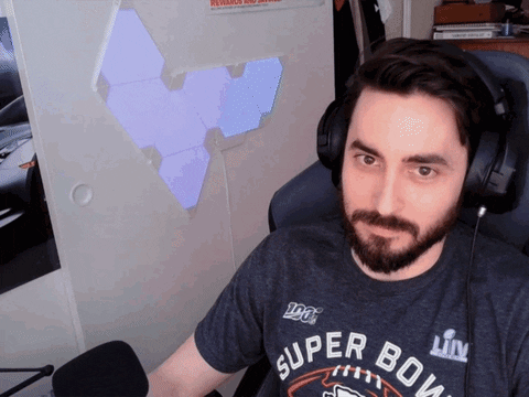 Man On Earphones Feeling Intrigued GIF