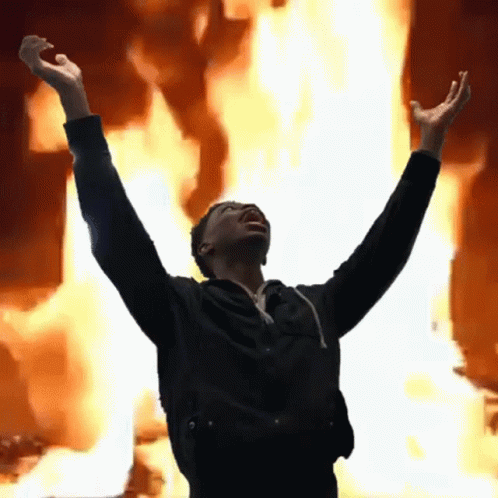 Man On Fire Arms Up Fiery Background GIF