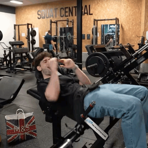 Man on Gym Machine Squat Central