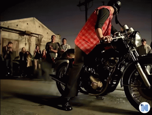 Man on Motorcycle With Letter N