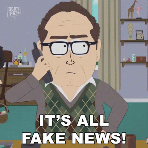 Man on Phone Saying It's All Fake News
