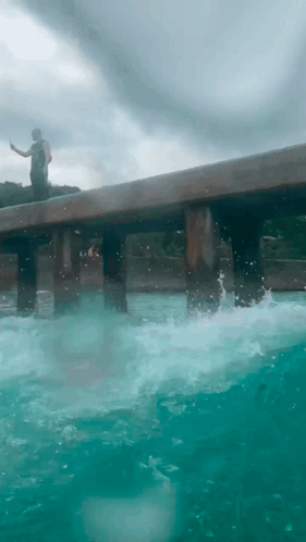 Man on Pier Overlooking Ocean