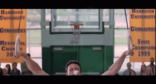 Man on Rings at Harrison University Gymnastics