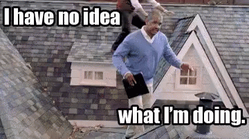 Man On Roof Holding Book And Tablet GIF