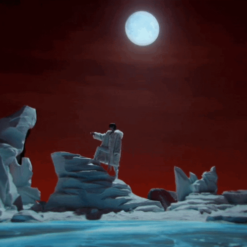 Man On Snow-Covered Mountain With Full Moon GIF