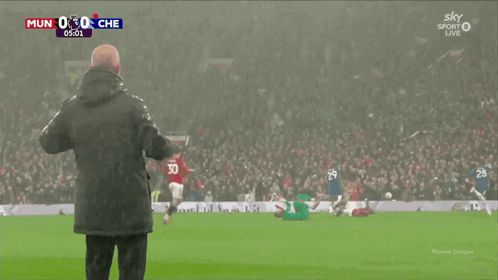 Man On Soccer Field In Front Of Crowd Watching Sky Sport Live GIF