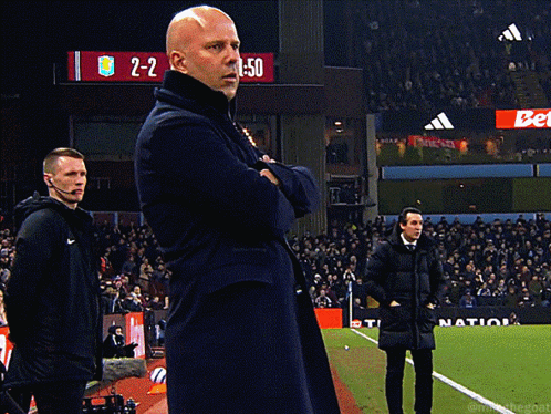 Man On Soccer Field In Front Of Scoreboard 2-2 GIF