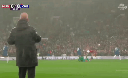 Man On Soccer Field Watching MUN Vs CHE GIF