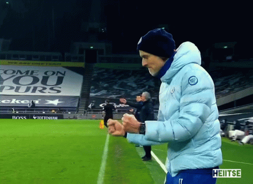 Man on Soccer Field with Come On Sign